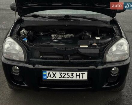 Черный Хендай Туксон, объемом двигателя 1.98 л и пробегом 260 тыс. км за 6900 $, фото 19 на Automoto.ua