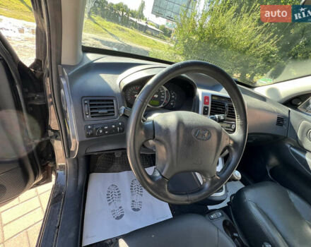 Чорний Хендай Туксон, об'ємом двигуна 2 л та пробігом 229 тис. км за 8400 $, фото 5 на Automoto.ua