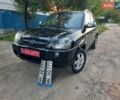 Черный Хендай Туксон, объемом двигателя 2 л и пробегом 219 тыс. км за 7990 $, фото 1 на Automoto.ua