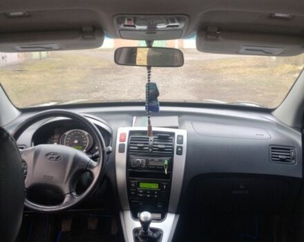 Чорний Хендай Туксон, об'ємом двигуна 2 л та пробігом 246 тис. км за 8100 $, фото 12 на Automoto.ua