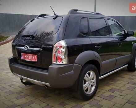 Чорний Хендай Туксон, об'ємом двигуна 2 л та пробігом 229 тис. км за 8600 $, фото 43 на Automoto.ua