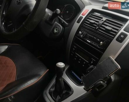 Черный Хендай Туксон, объемом двигателя 2 л и пробегом 210 тыс. км за 8999 $, фото 60 на Automoto.ua