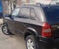 Чорний Хендай Туксон, об'ємом двигуна 1.99 л та пробігом 229 тис. км за 8199 $, фото 1 на Automoto.ua