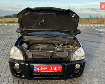 Черный Хендай Туксон, объемом двигателя 1.98 л и пробегом 243 тыс. км за 8500 $, фото 33 на Automoto.ua