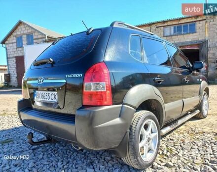 Черный Хендай Туксон, объемом двигателя 2 л и пробегом 219 тыс. км за 8500 $, фото 9 на Automoto.ua