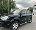 Черный Хендай Туксон, объемом двигателя 2 л и пробегом 199 тыс. км за 7820 $, фото 1 на Automoto.ua