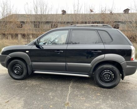 Черный Хендай Туксон, объемом двигателя 2 л и пробегом 330 тыс. км за 4350 $, фото 4 на Automoto.ua