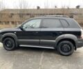 Черный Хендай Туксон, объемом двигателя 2 л и пробегом 330 тыс. км за 4350 $, фото 4 на Automoto.ua