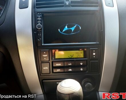 Черный Хендай Туксон, объемом двигателя 2 л и пробегом 230 тыс. км за 8000 $, фото 4 на Automoto.ua