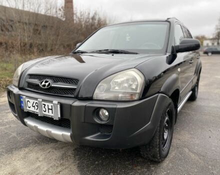 Черный Хендай Туксон, объемом двигателя 2 л и пробегом 330 тыс. км за 4350 $, фото 2 на Automoto.ua