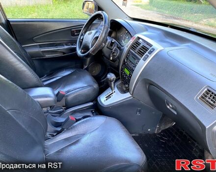 Черный Хендай Туксон, объемом двигателя 2.7 л и пробегом 145 тыс. км за 6950 $, фото 6 на Automoto.ua