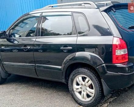 Чорний Хендай Туксон, об'ємом двигуна 2 л та пробігом 308 тис. км за 7555 $, фото 2 на Automoto.ua