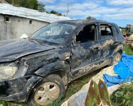 Черный Хендай Туксон, объемом двигателя 2 л и пробегом 250 тыс. км за 3500 $, фото 1 на Automoto.ua