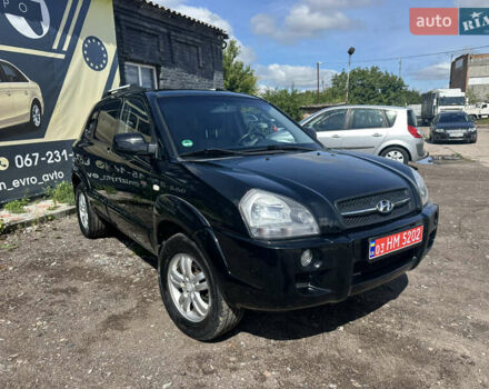 Черный Хендай Туксон, объемом двигателя 2 л и пробегом 198 тыс. км за 8600 $, фото 2 на Automoto.ua