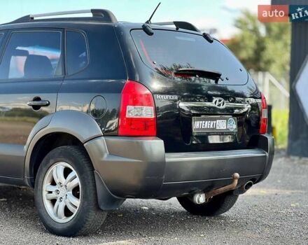 Черный Хендай Туксон, объемом двигателя 2 л и пробегом 227 тыс. км за 8200 $, фото 11 на Automoto.ua