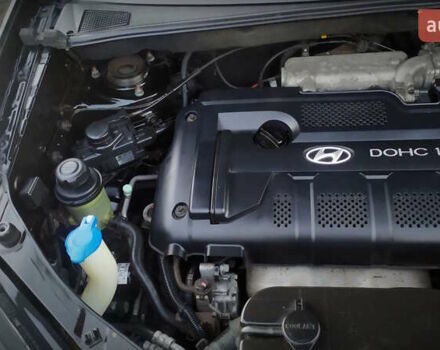 Черный Хендай Туксон, объемом двигателя 2 л и пробегом 230 тыс. км за 8600 $, фото 203 на Automoto.ua