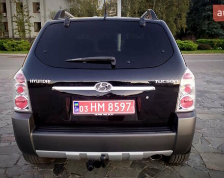 Черный Хендай Туксон, объемом двигателя 2 л и пробегом 230 тыс. км за 8600 $, фото 118 на Automoto.ua