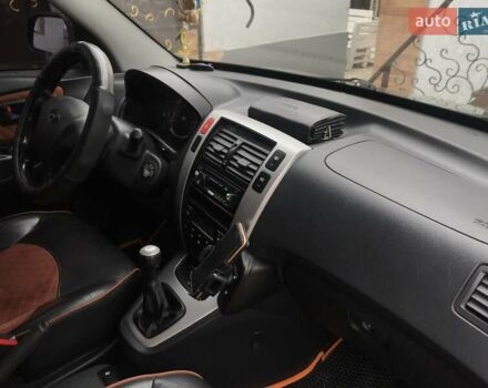 Черный Хендай Туксон, объемом двигателя 2 л и пробегом 210 тыс. км за 8999 $, фото 57 на Automoto.ua