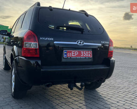 Черный Хендай Туксон, объемом двигателя 1.98 л и пробегом 243 тыс. км за 8500 $, фото 4 на Automoto.ua