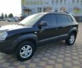 Черный Хендай Туксон, объемом двигателя 2 л и пробегом 240 тыс. км за 7900 $, фото 1 на Automoto.ua