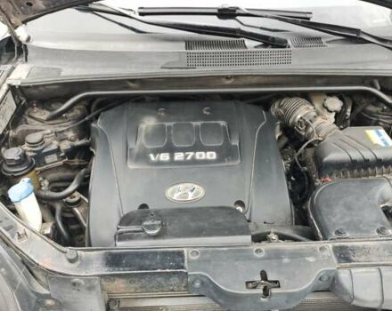 Черный Хендай Туксон, объемом двигателя 2.7 л и пробегом 280 тыс. км за 7200 $, фото 7 на Automoto.ua