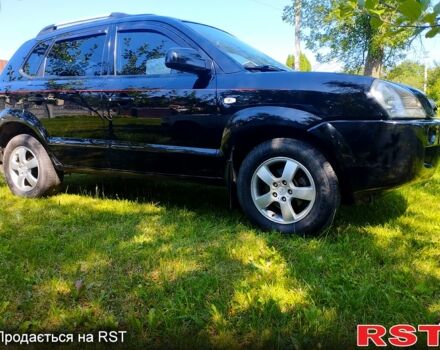 Черный Хендай Туксон, объемом двигателя 2 л и пробегом 230 тыс. км за 8000 $, фото 1 на Automoto.ua