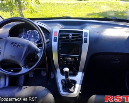 Черный Хендай Туксон, объемом двигателя 2 л и пробегом 230 тыс. км за 8000 $, фото 6 на Automoto.ua