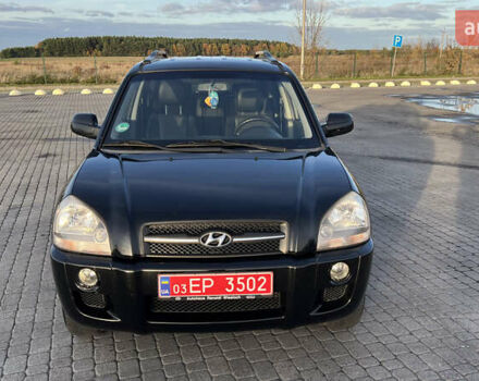 Черный Хендай Туксон, объемом двигателя 1.98 л и пробегом 243 тыс. км за 8500 $, фото 2 на Automoto.ua