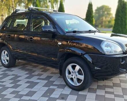 Черный Хендай Туксон, объемом двигателя 2 л и пробегом 190 тыс. км за 8150 $, фото 6 на Automoto.ua