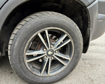 Черный Хендай Туксон, объемом двигателя 1.99 л и пробегом 266 тыс. км за 7500 $, фото 6 на Automoto.ua