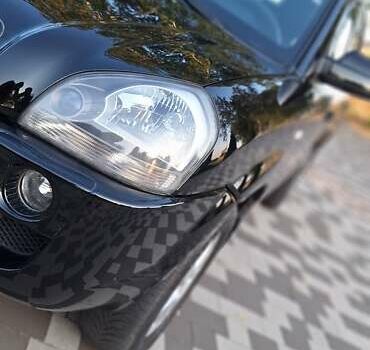 Черный Хендай Туксон, объемом двигателя 2 л и пробегом 190 тыс. км за 8150 $, фото 15 на Automoto.ua