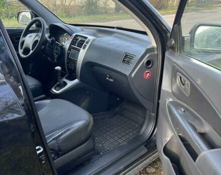 Черный Хендай Туксон, объемом двигателя 1.99 л и пробегом 302 тыс. км за 6900 $, фото 1 на Automoto.ua