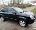 Черный Хендай Туксон, объемом двигателя 2 л и пробегом 240 тыс. км за 7300 $, фото 1 на Automoto.ua