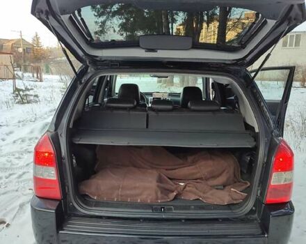 Черный Хендай Туксон, объемом двигателя 1.98 л и пробегом 335 тыс. км за 7800 $, фото 7 на Automoto.ua