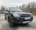 Черный Хендай Туксон, объемом двигателя 2 л и пробегом 330 тыс. км за 4350 $, фото 1 на Automoto.ua