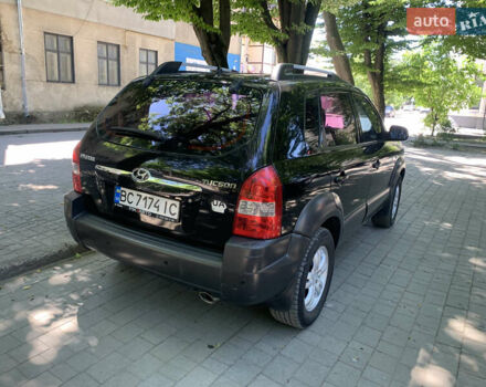 Черный Хендай Туксон, объемом двигателя 1.98 л и пробегом 232 тыс. км за 9100 $, фото 5 на Automoto.ua