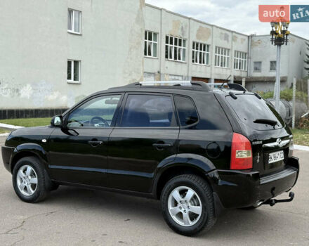 Черный Хендай Туксон, объемом двигателя 2 л и пробегом 300 тыс. км за 7350 $, фото 18 на Automoto.ua