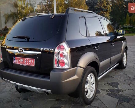 Черный Хендай Туксон, объемом двигателя 2 л и пробегом 230 тыс. км за 8600 $, фото 40 на Automoto.ua
