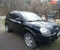 Черный Хендай Туксон, объемом двигателя 2 л и пробегом 250 тыс. км за 7299 $, фото 1 на Automoto.ua