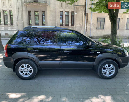 Черный Хендай Туксон, объемом двигателя 1.98 л и пробегом 232 тыс. км за 9100 $, фото 4 на Automoto.ua