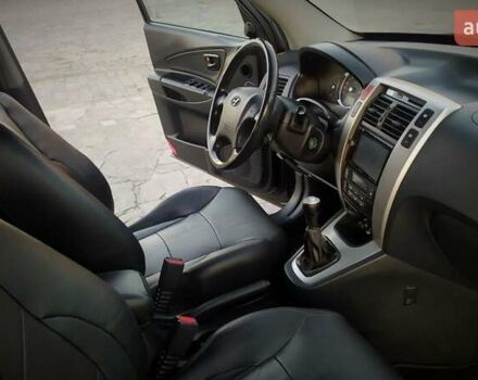 Черный Хендай Туксон, объемом двигателя 2 л и пробегом 230 тыс. км за 8600 $, фото 153 на Automoto.ua