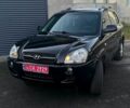 Черный Хендай Туксон, объемом двигателя 2 л и пробегом 211 тыс. км за 7800 $, фото 1 на Automoto.ua