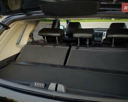 Черный Хендай Туксон, объемом двигателя 2 л и пробегом 230 тыс. км за 8600 $, фото 125 на Automoto.ua