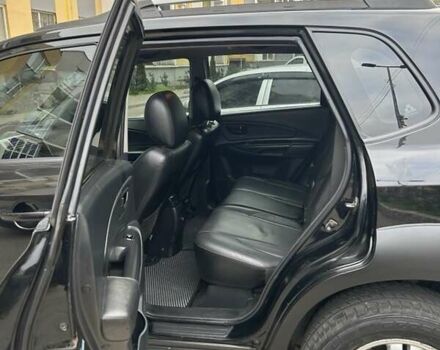 Черный Хендай Туксон, объемом двигателя 1.98 л и пробегом 147 тыс. км за 8000 $, фото 3 на Automoto.ua