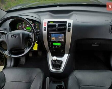 Чорний Хендай Туксон, об'ємом двигуна 2 л та пробігом 229 тис. км за 8600 $, фото 115 на Automoto.ua