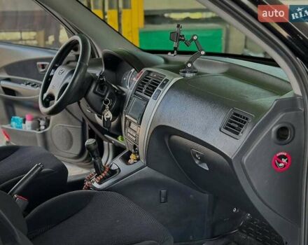 Черный Хендай Туксон, объемом двигателя 2 л и пробегом 310 тыс. км за 6499 $, фото 10 на Automoto.ua