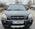 Черный Хендай Туксон, объемом двигателя 2 л и пробегом 330 тыс. км за 4350 $, фото 1 на Automoto.ua