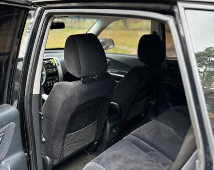 Черный Хендай Туксон, объемом двигателя 1.99 л и пробегом 266 тыс. км за 7500 $, фото 9 на Automoto.ua