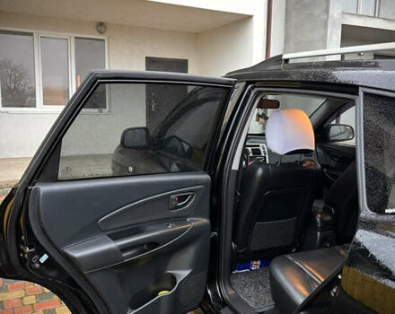 Черный Хендай Туксон, объемом двигателя 2 л и пробегом 151 тыс. км за 9100 $, фото 14 на Automoto.ua