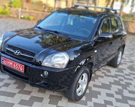 Черный Хендай Туксон, объемом двигателя 2 л и пробегом 190 тыс. км за 8150 $, фото 3 на Automoto.ua